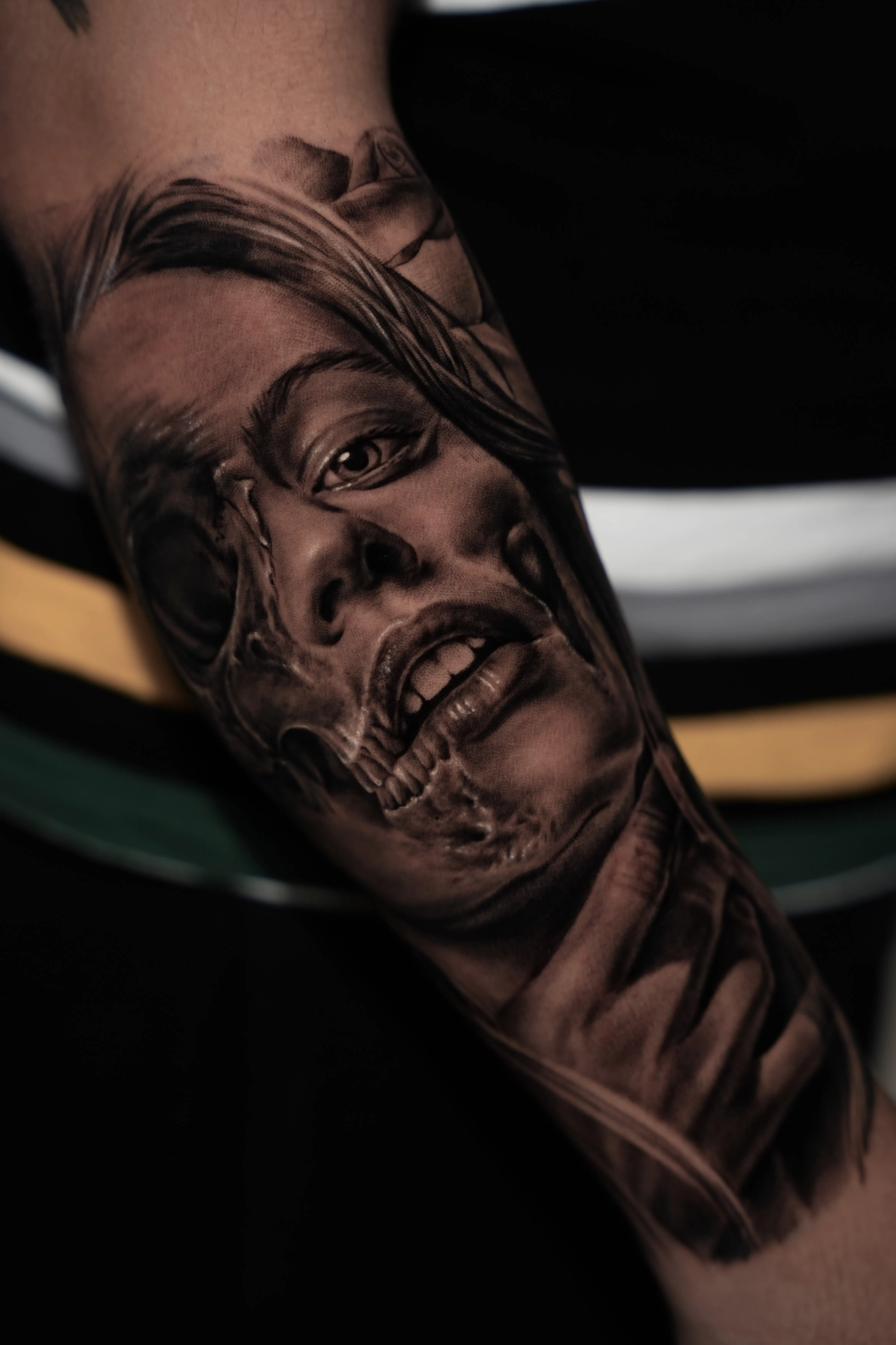 Black-and-grey surreal realism, a woman’s face morphing into a screaming skull — Hector Rodriguez Goderich